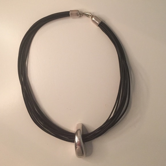 Black necklace with silver stone pendant