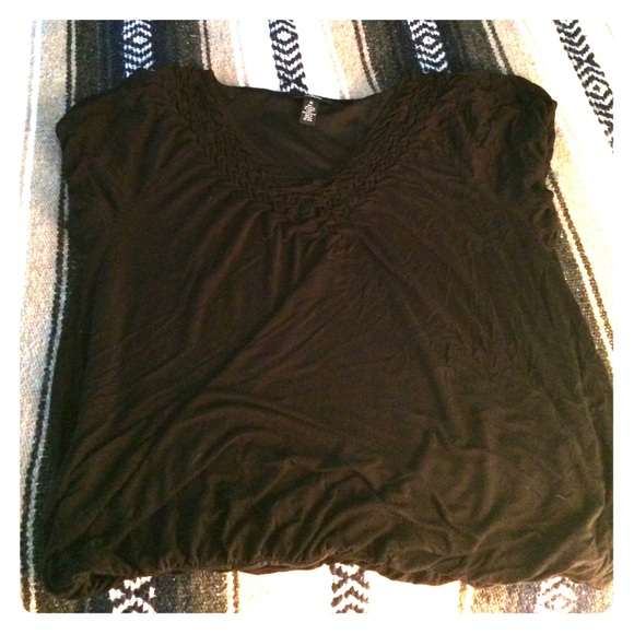 Black, styled, v-neck top.