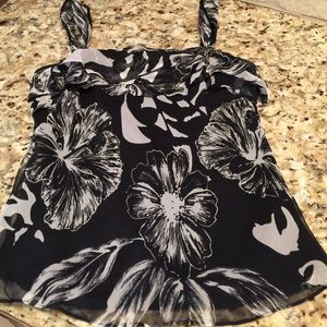 Soft and flowing sheer but lined top.