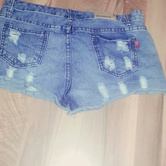 Denim shorts. With tiny holes all over.
