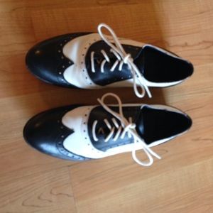 Black and white leather loafers