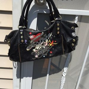 IT A MUST HAVE !!!!ED HARDY BAG.