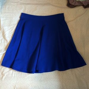 Blue skater skirt worn lightly