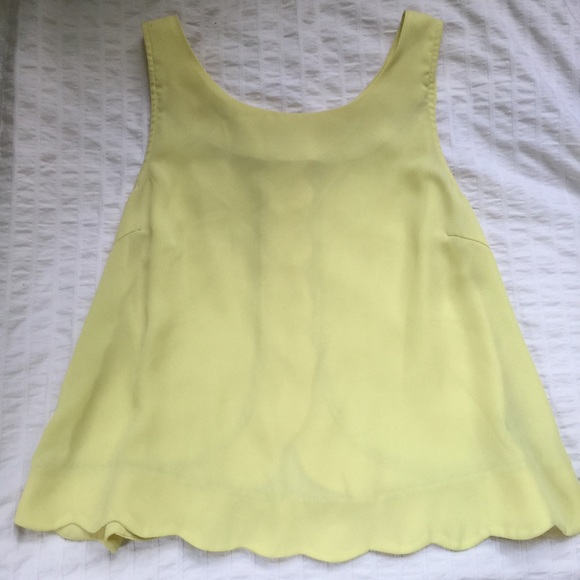 Yellow chiffon sleeveless blouse.