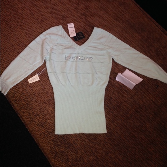 Brand new Bebe mint colored sweater size SMALL.
