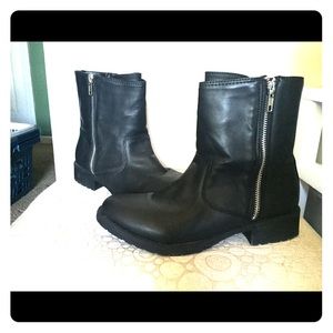 Black leather boots with silver zipper