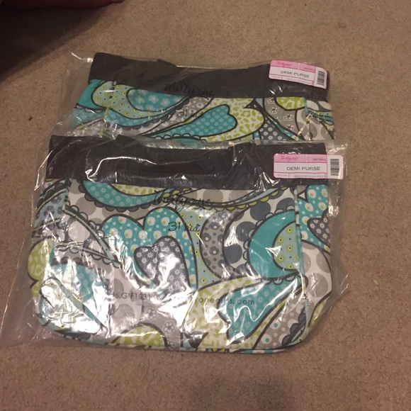 (2) Thirty-one Demi purses