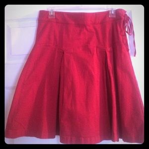 Red midi length pleated skirt