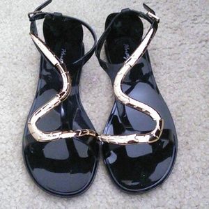 Black jelly sandals with snake serpent design