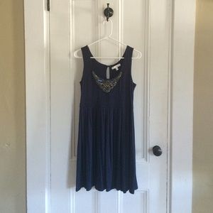 Navy blue pleated dress with embellishments