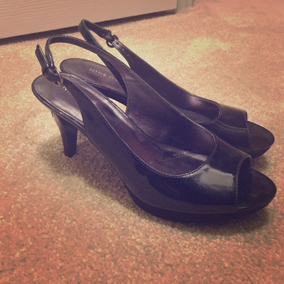 black opened-toe leather heels