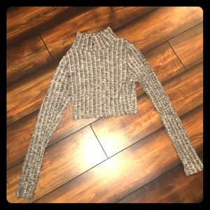 Gray knit turtleneck crop top.
