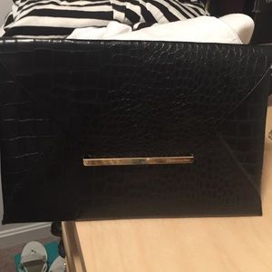 BCBG black pattern clutch