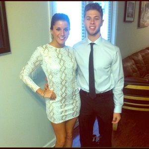 A white a gold snake sequence dress