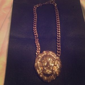 Lion face necklace.