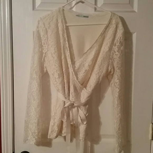 Cream colored, long sleeved top