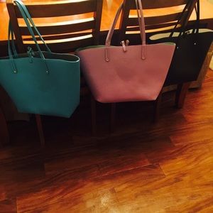 Iman reversible totes.