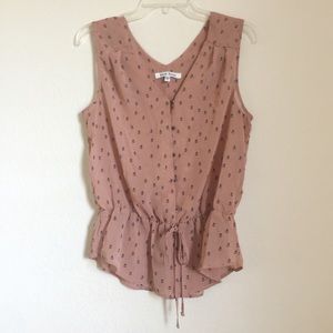 Sleeveless, v neck blouse with stretchy waist