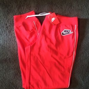 Red Nike jogger pants