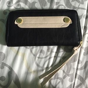 Semi new black and gold Steve Madden wallet.