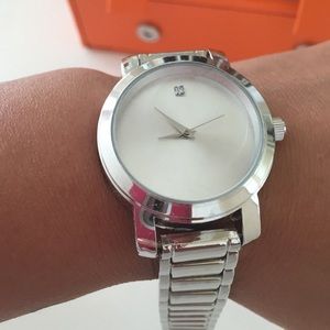 Silver slick watch with a rhinestone