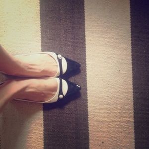 Black and white patent leather flats