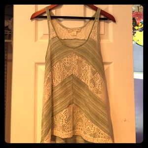 Beach-y sleeveless green top.