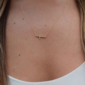 Sideways cross gold necklace