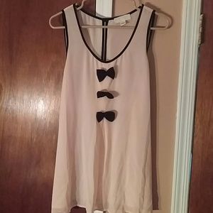 Peach sleeveless black bow tie tie back blouse