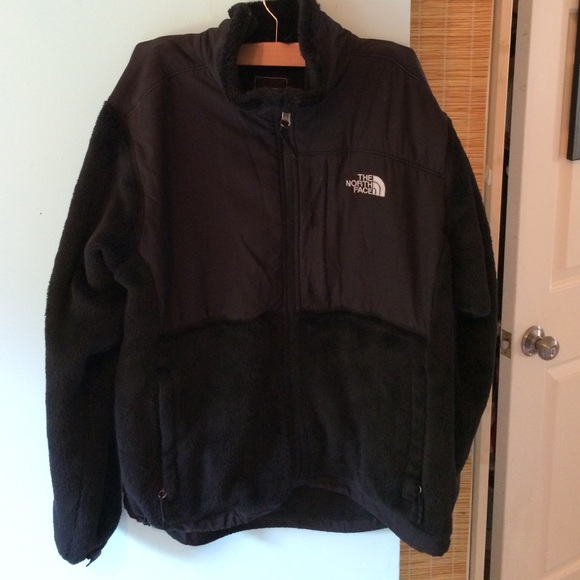 Black, fuzzy North Face jacket