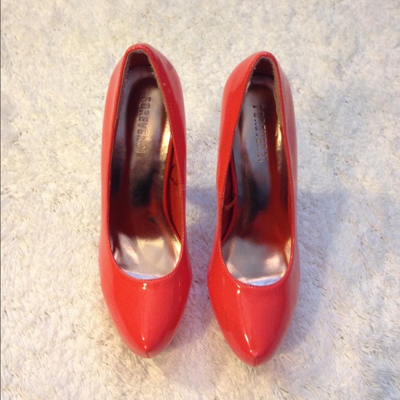 $SOLD$Orange shinny stilettos.