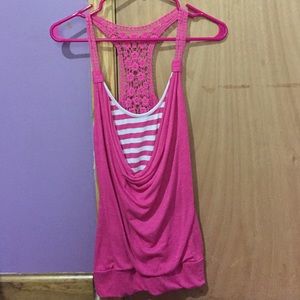 A pink and white tank top with lacy straps & back