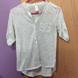 A flowy, rolled, short sleeved button up