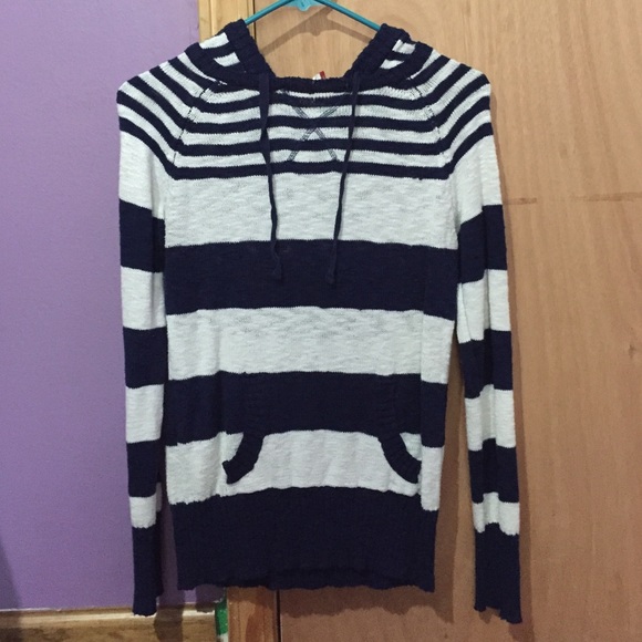 A striped long sleeve hooded sweater