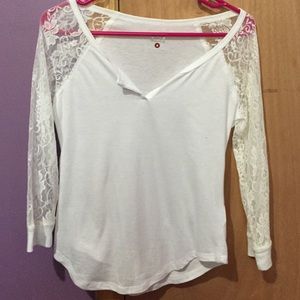 A white long lacy sleeved top