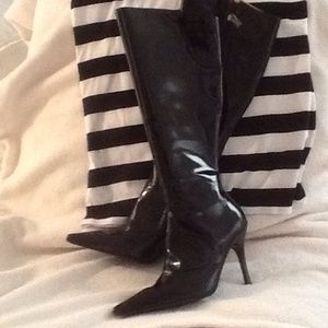 Black Baby Phat patent leather boots.