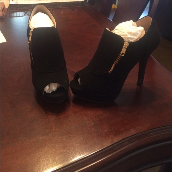 High heel peep toe ankle boots.