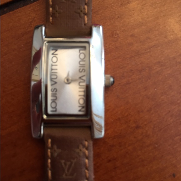 Silver watch, logo leather band.