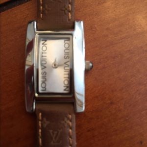 Silver watch, logo leather band.