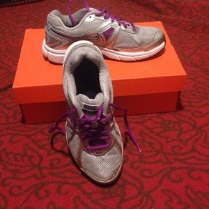 Silver Nike running shoes
