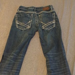 Size 27R Aiden buckle jeans Med/ Dark wash.