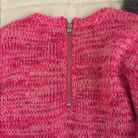 Knit pink and white detailed sweater.
