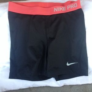 Black nike spandex with coral top.