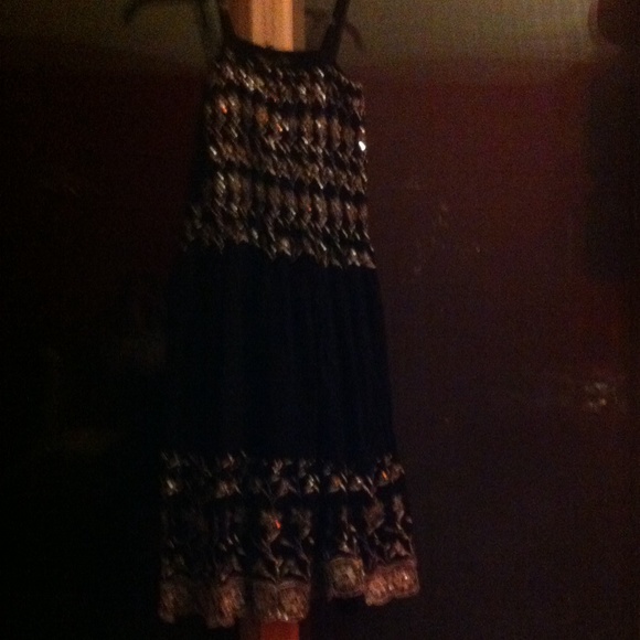 Black and silver knee length dress.
