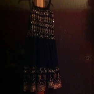 Black and silver knee length dress.