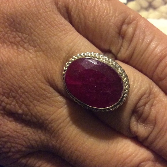 Vintage silver ring with ruby colored stone.