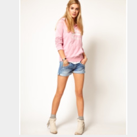 Light denim rolled shorts from UO