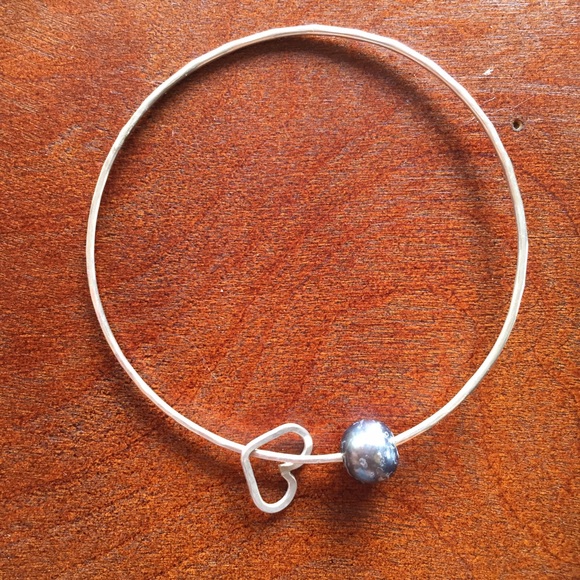 Hammered sterling silver beach bangle with charm