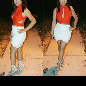 Orange crop top and white skirt