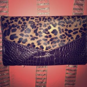 Dark brown and leather clutch Dark brown and leather clutch